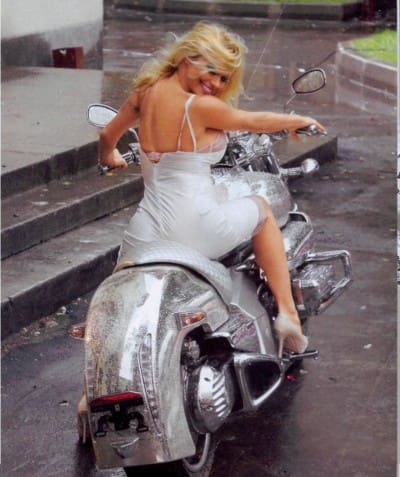 Pamela Anderson Posing on a Cosmichrome bike in Moscow