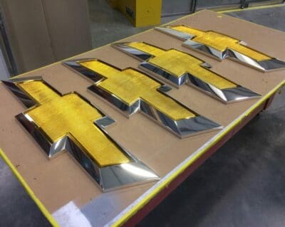 Chevy Bow Tie Signs made from foam and coated with Cosmichrome